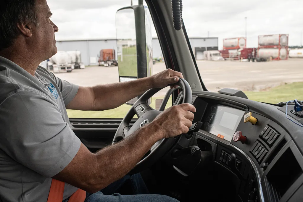 Store & Haul driver walking to a red semi truck